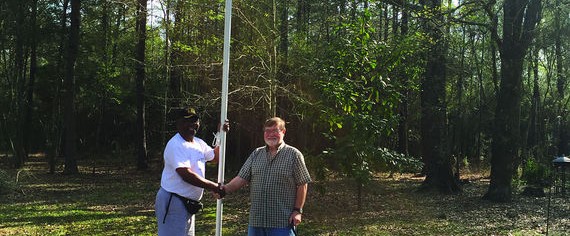 Veteran Charles Russell receives flags, pole as birthday present
