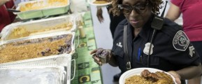Detroit officer NPO C. Burks-Weathers from the 2nd Precinct takes her lunch during the Detroit Police luncheon on Friday, July 15, 2016 at the Vietnam Veterans of America Post in Detroit. (Photo: Tim Galloway, Special to the Free Press)