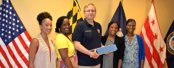 Len Ignatowski, Vice President of Vietnam Veterans of America Chapter 227 presents ninety-one $ 50 gift cards to local Veteran Administration case workers for back-to-school needs of homeless veteran children. Left to Right: Miracle Hallman, Ky'Neihe King, Leonard Ignatowski, Vice President VVA Chapter 227, Janell Scott, Yolanda Peay. Photo by Gary Strange, Veterans Administration.